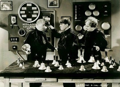 Three men on a vintage television studio set