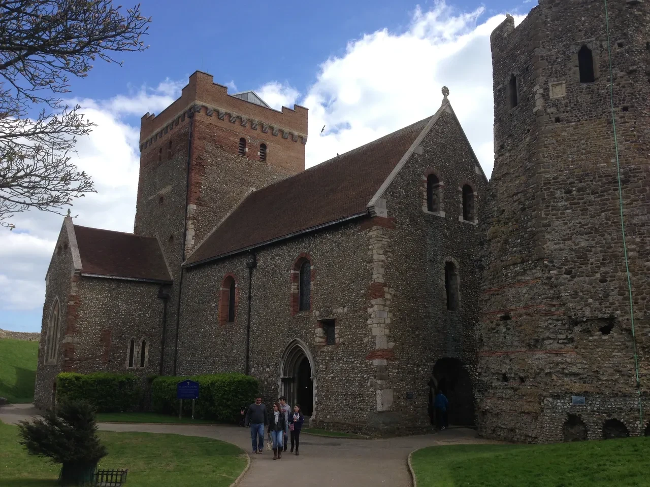 Historic stone church with towers and Norman architecture